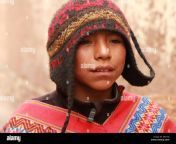 a quechua boy wears a traditional chulo hat and poncho in the streets d821yj.jpg from chulo