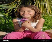cute brazilian six year old girl holding a flower in nature dggth5.jpg from 6 iyar garl x
