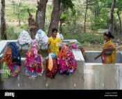indian mother and daughter washing clothes by hand in a large concrete ddpxem.jpg from indian mom cloth washing