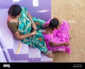 young rural indian village woman having her hair plaited by her sister dn4k9m.jpg from telugu villege anty