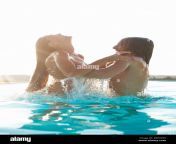romantic couple having fun in outdoor swimming pool man lifting woman dwcnp9.jpg from lovers having fun outdoor