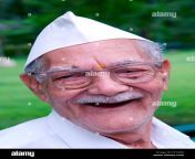 indian old man laughing with gandhi cap mr784m et18rg.jpg from indian with old uncle