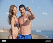 happy young couple in love taking amateur self portrait photos on f80x22.jpg from amateur couple
