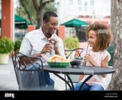 father and daughter eating at outdoor restaurant table f8grdb.jpg from pore father and daughter