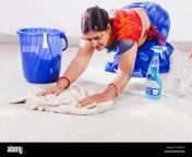 1 indian adult woman housewife cleaning floor f2wgtk.jpg from aunty clining room