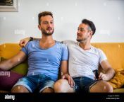 dos hombres gay en el sofa abrazando en casa rpp8ef.jpg from video dos gay