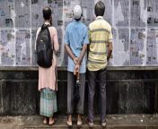 afp pedestrians read bangladeshs local newspapers.jpg from banla jut ket xxx